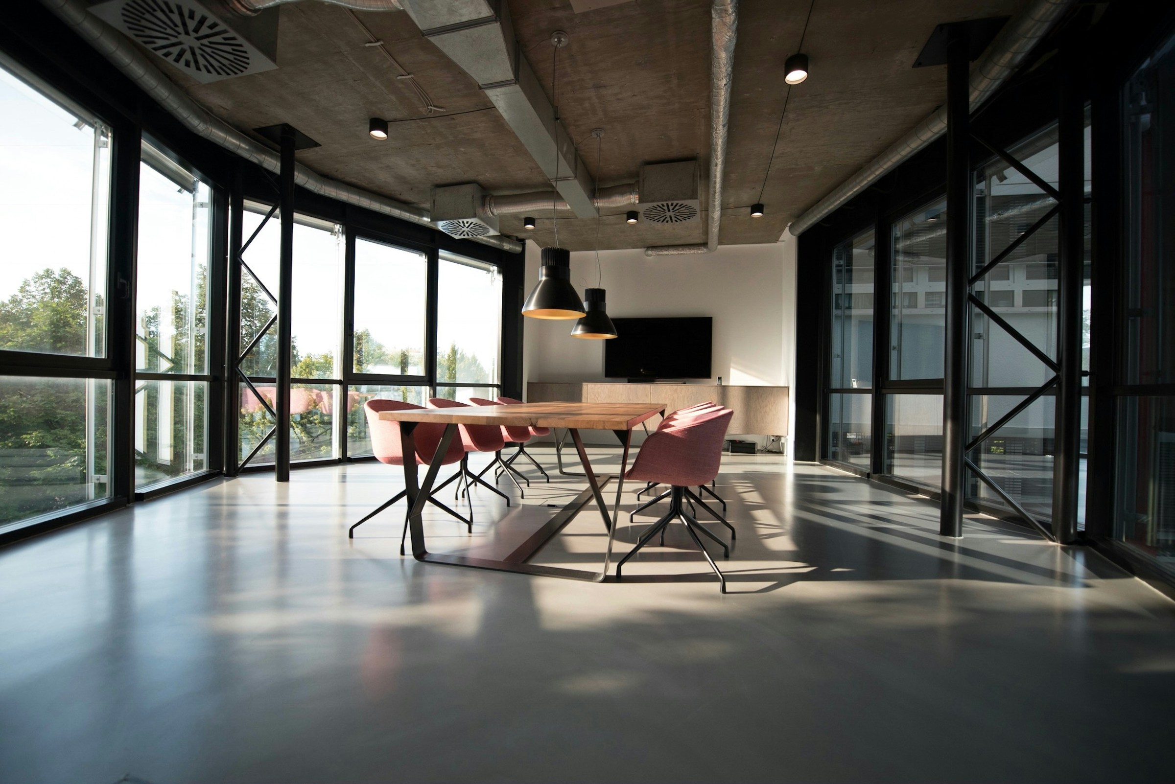 Mayfair private boardroom — sleek modern meeting table, restrained luxury